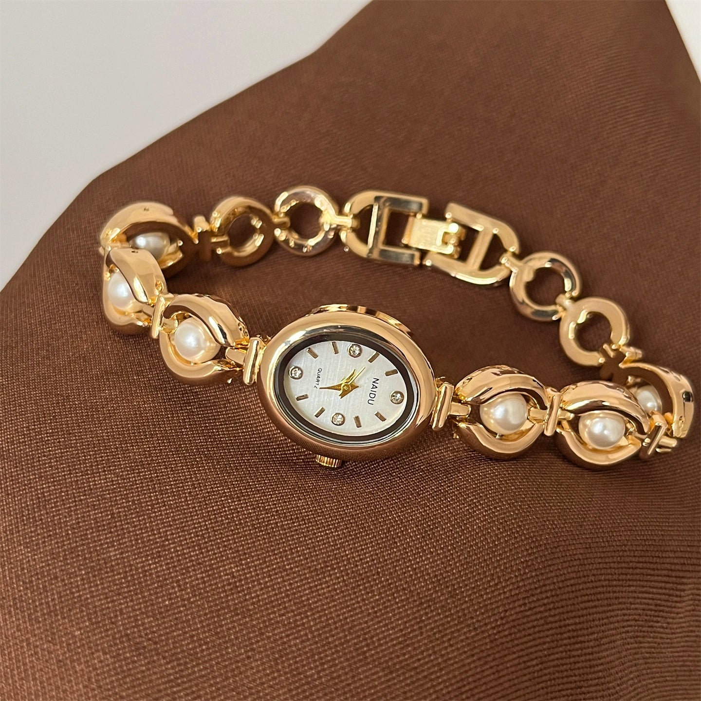 Camelia Oval Pearl Bracelet Watch - Gold Band White Face [DC1J20WW]