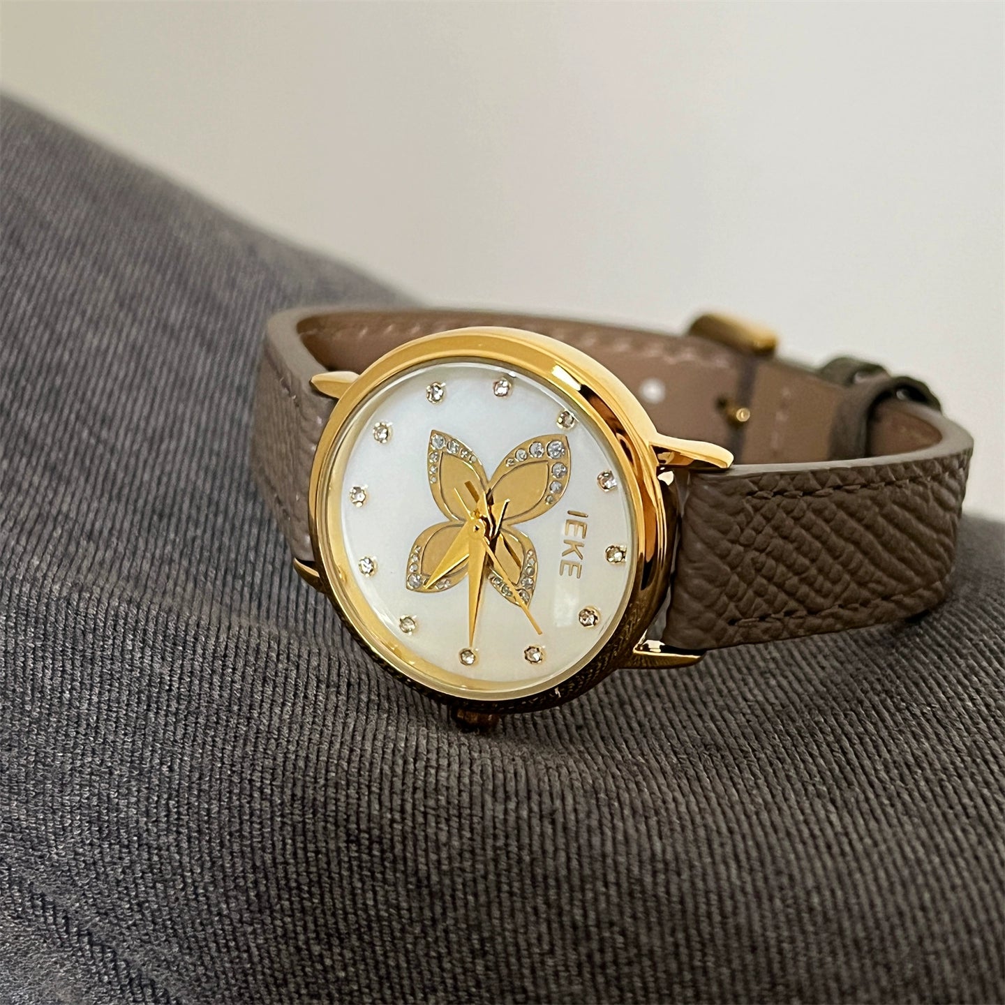 Lacy Butterfly Rhinestone Watch - Grey Strap Gold Frame White Face [A34L7SMR]