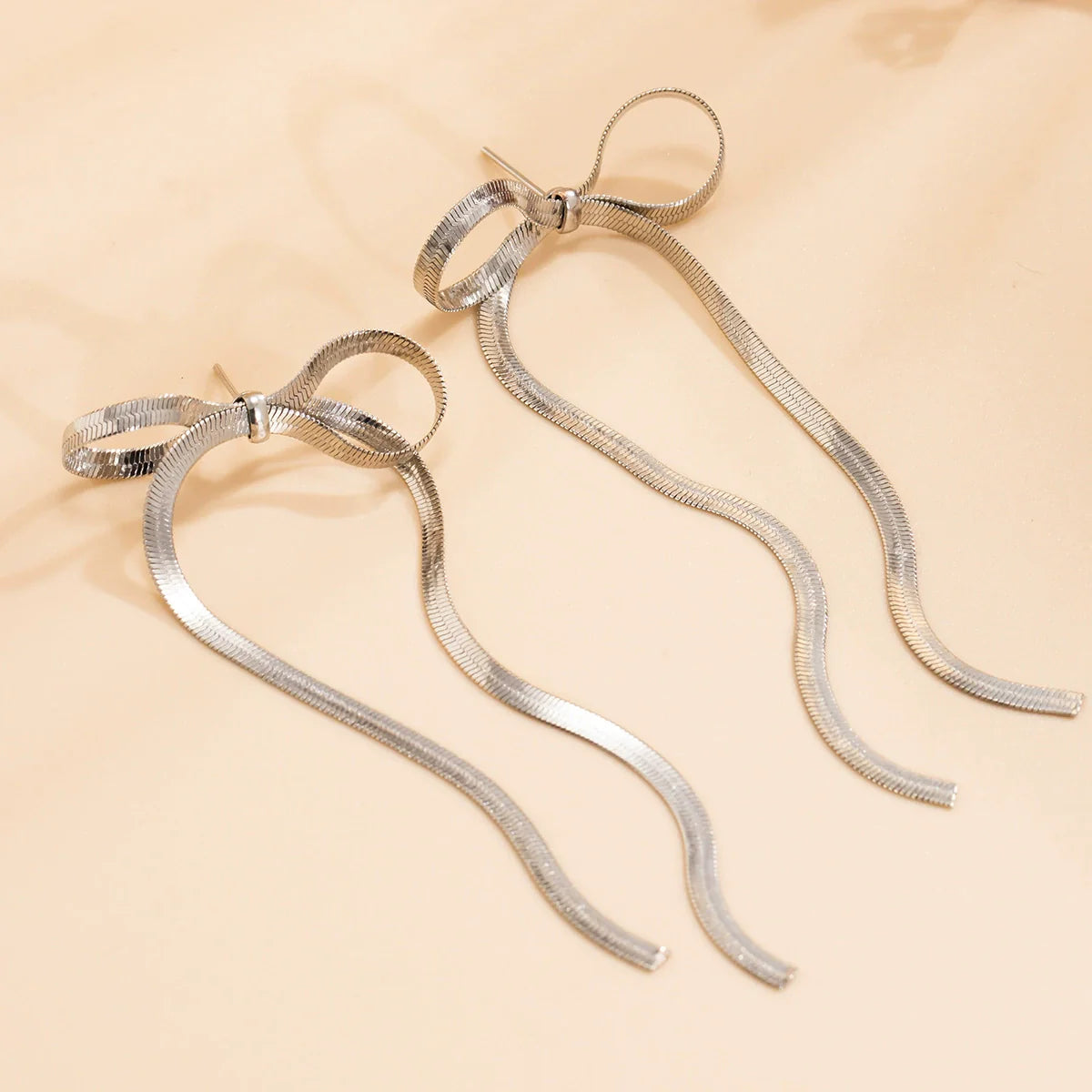 Callyn Bow Butterfly Earrings - Long Silver