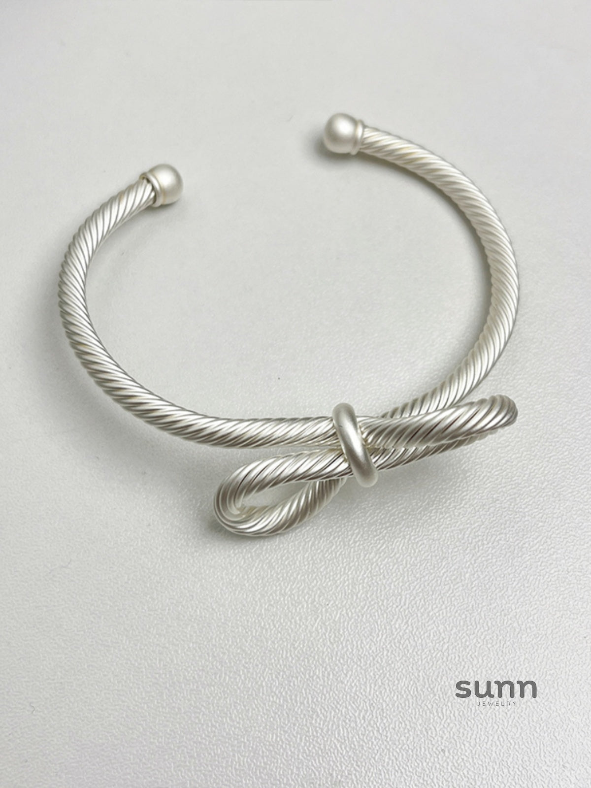 Amauri Frosted Braided Bow Bracelet [O0SI0UDH]