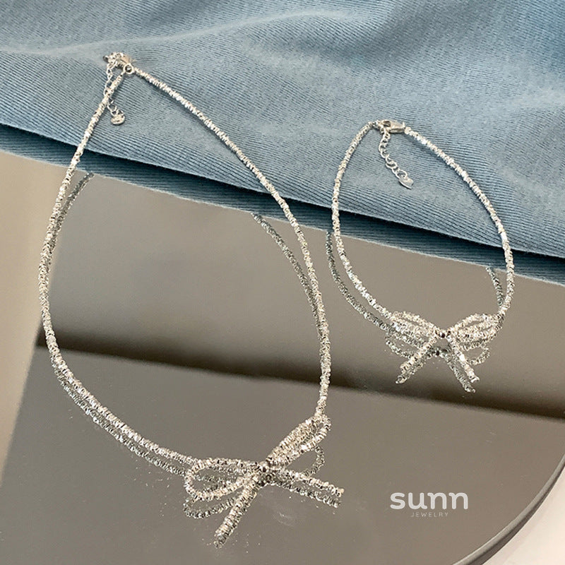 Ashtyn Glitter Bow Necklace [PGEW09H6]