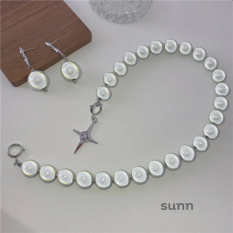 Brianna Reflective Pearl Cross Necklace