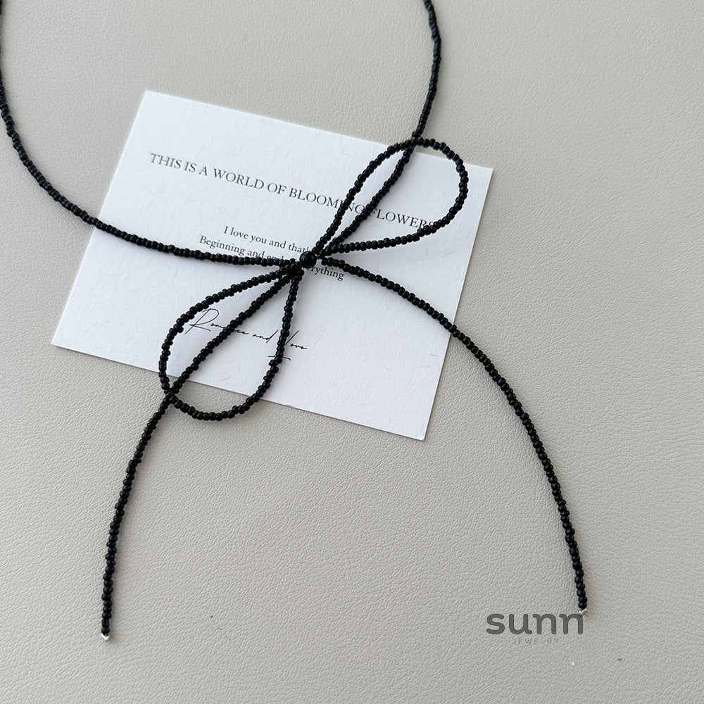 Faye Crystal Bow Choker Necklace [JYN09CW5]