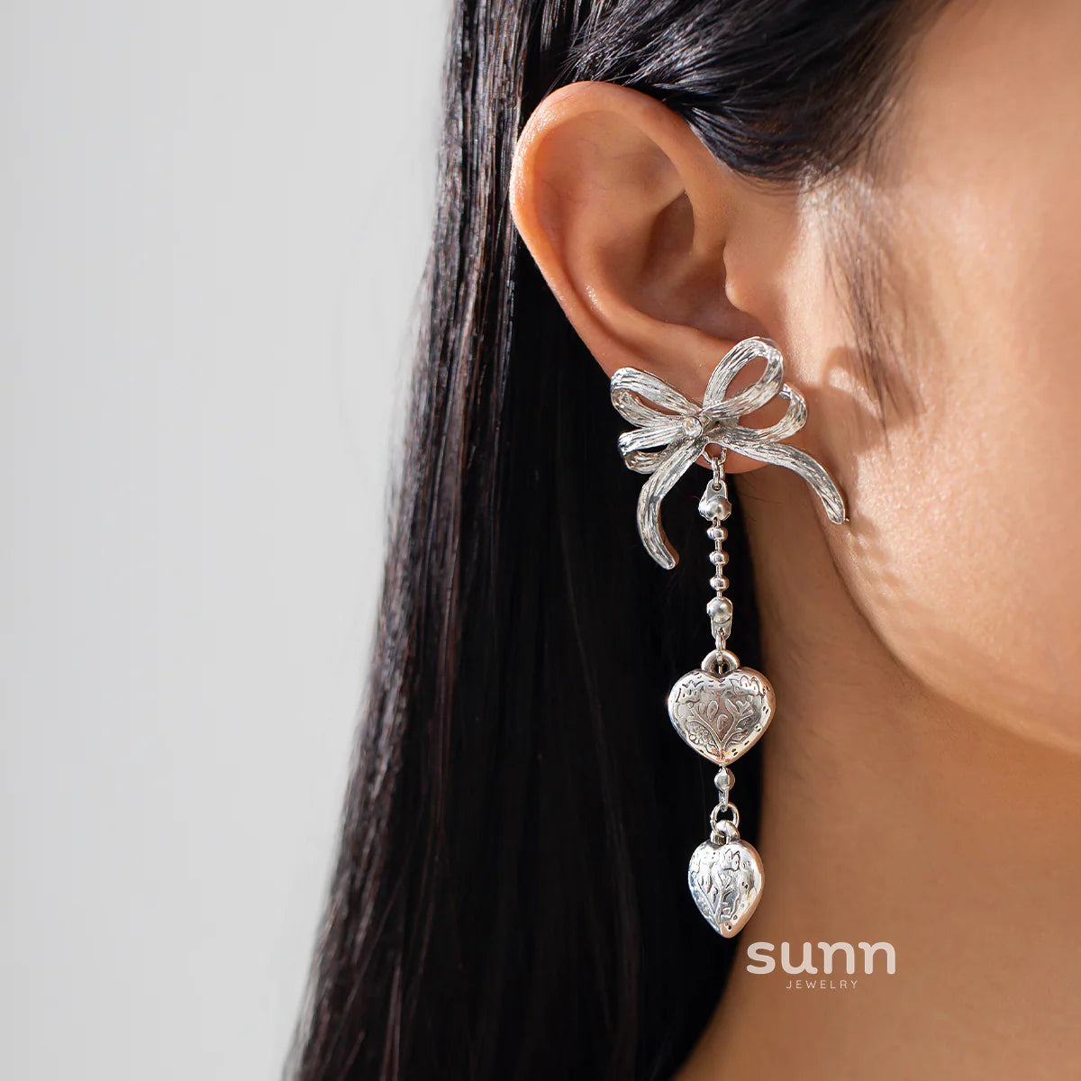 Jodi Heart Bow Tassel Studs