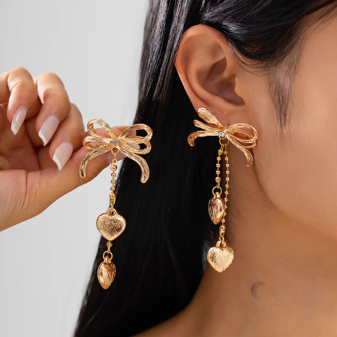 Jodi Heart Bow Tassel Studs
