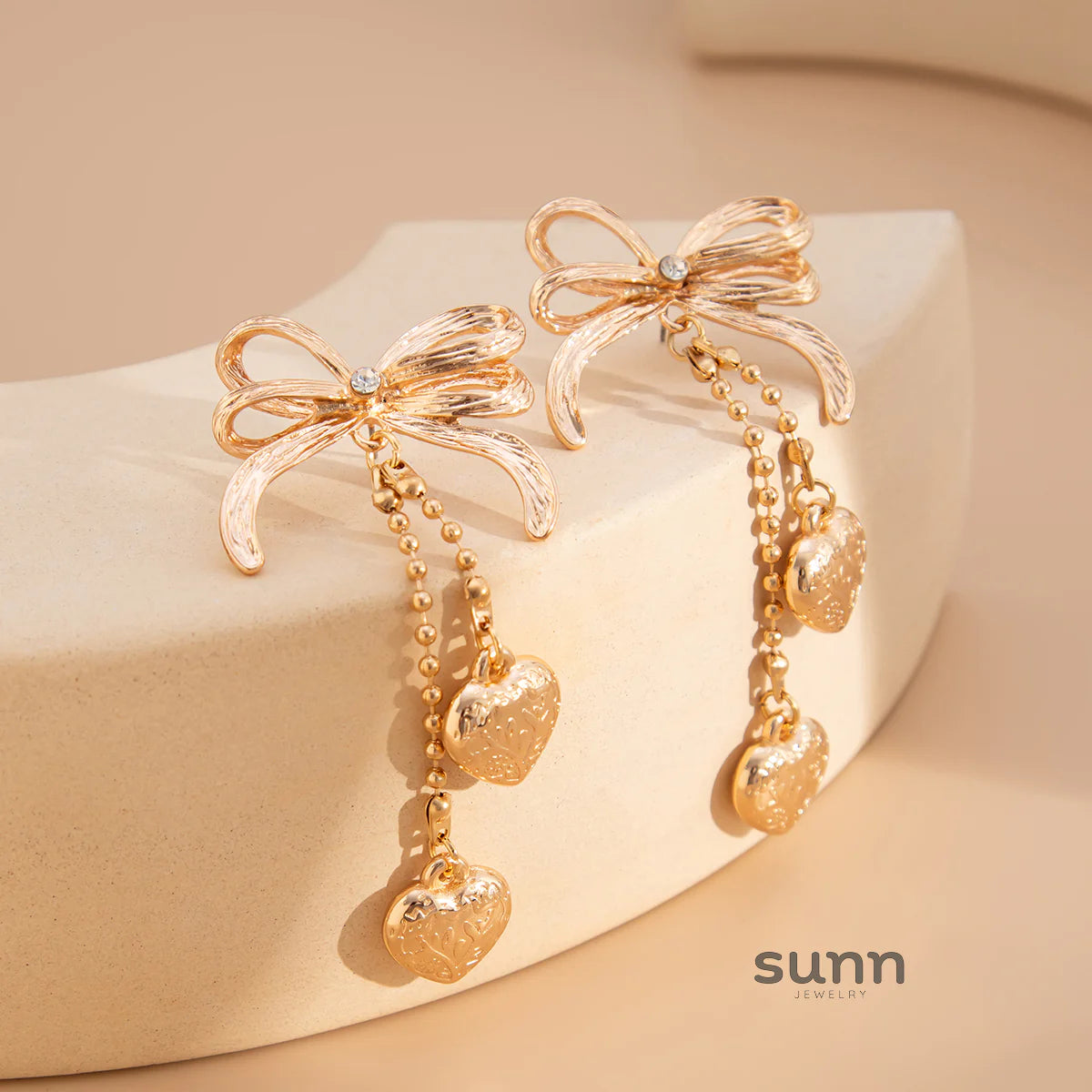 Jodi Heart Bow Tassel Studs