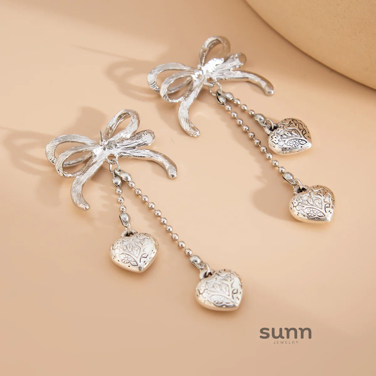 Jodi Heart Bow Tassel Studs