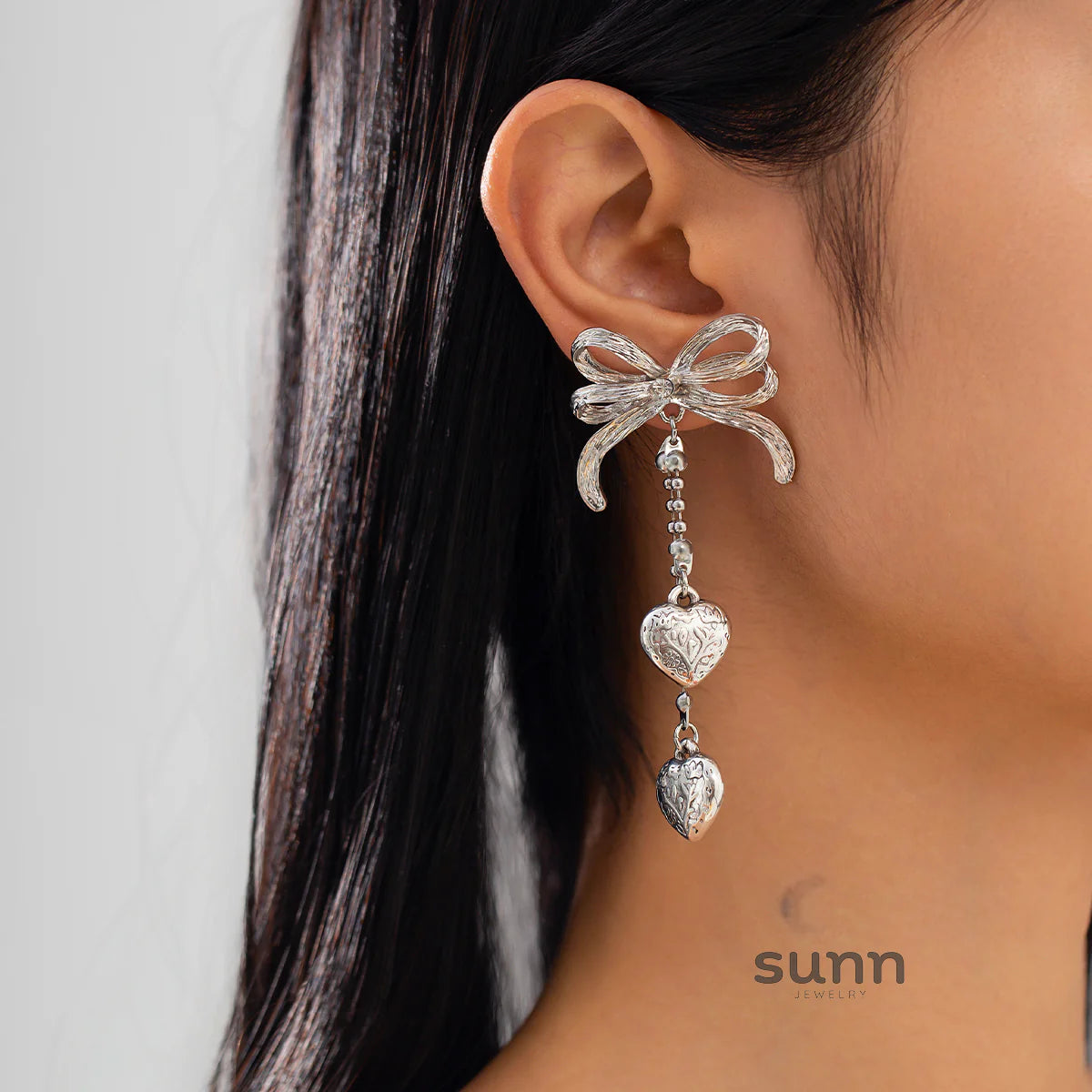 Jodi Heart Bow Tassel Studs