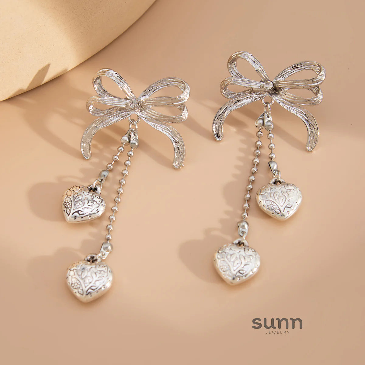 Jodi Heart Bow Tassel Studs