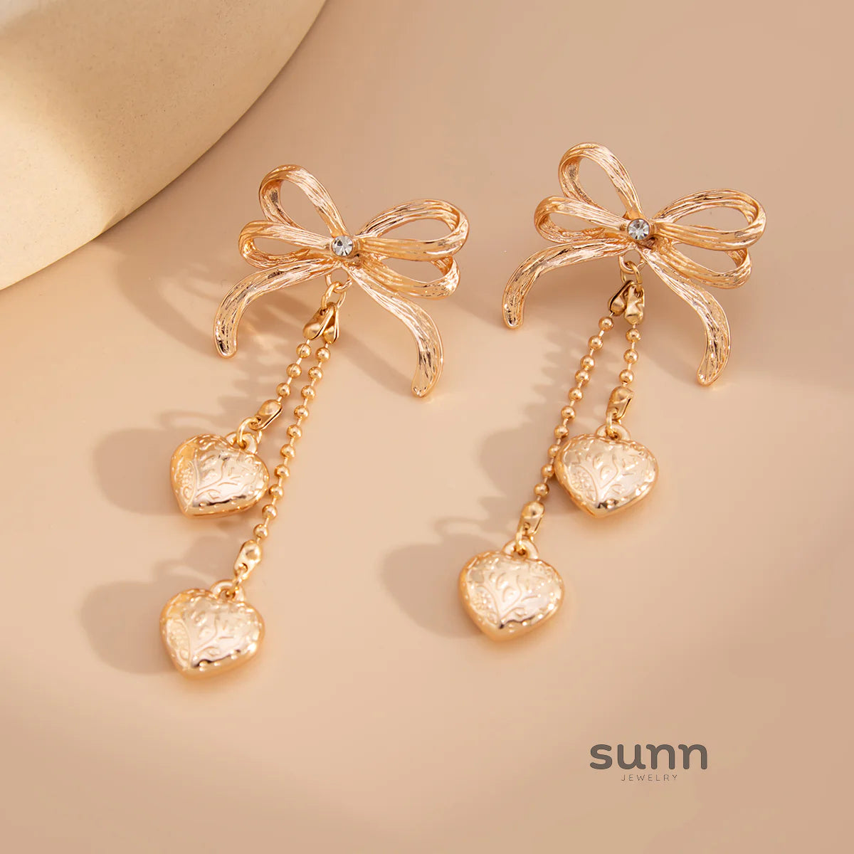 Jodi Heart Bow Tassel Studs