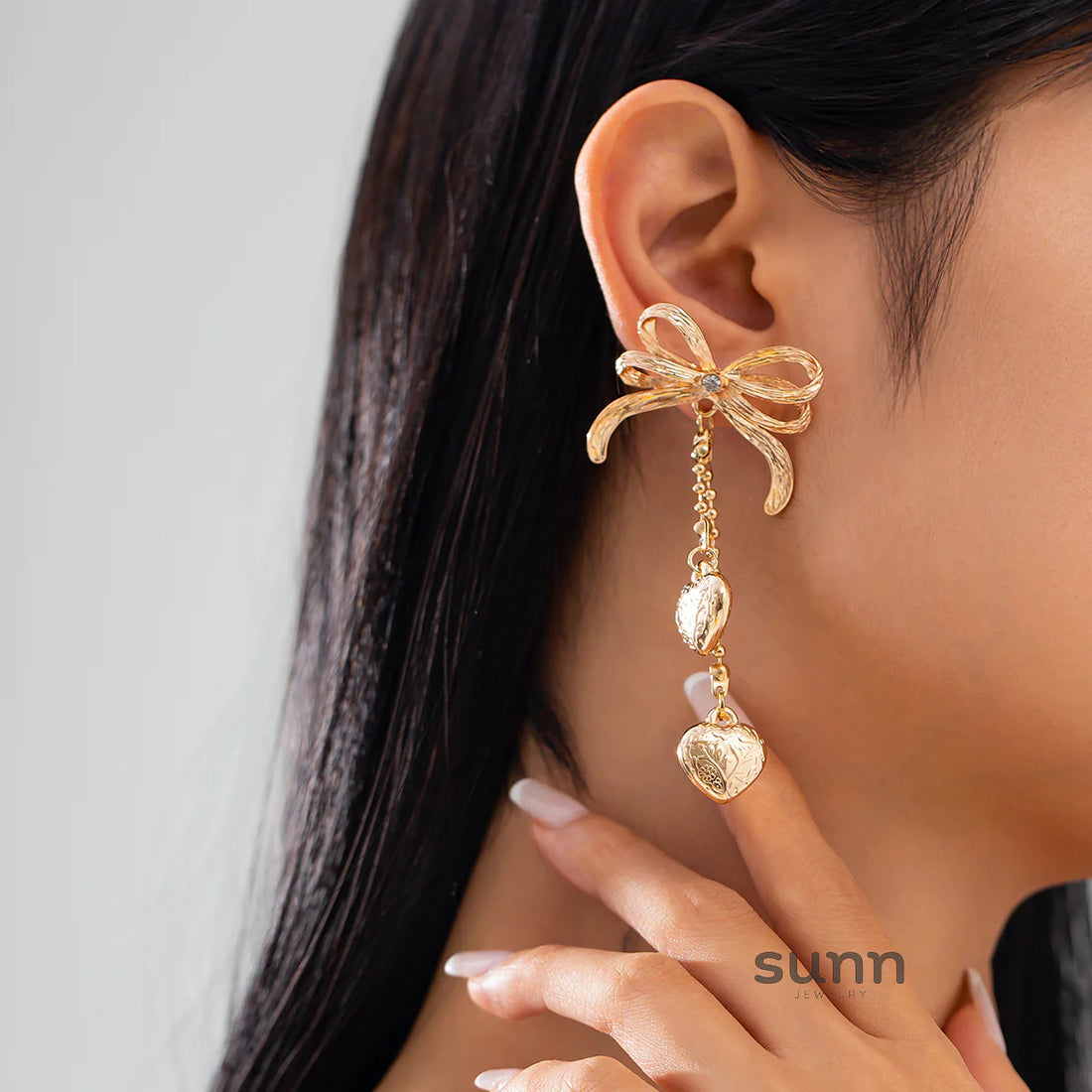 Jodi Heart Bow Tassel Studs