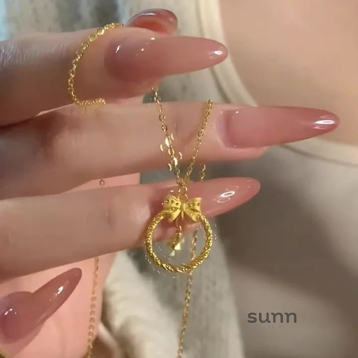 Krisha Gold Bow Bell Necklace