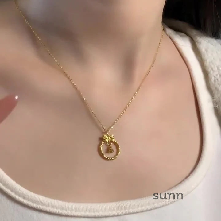 Krisha Gold Bow Bell Necklace