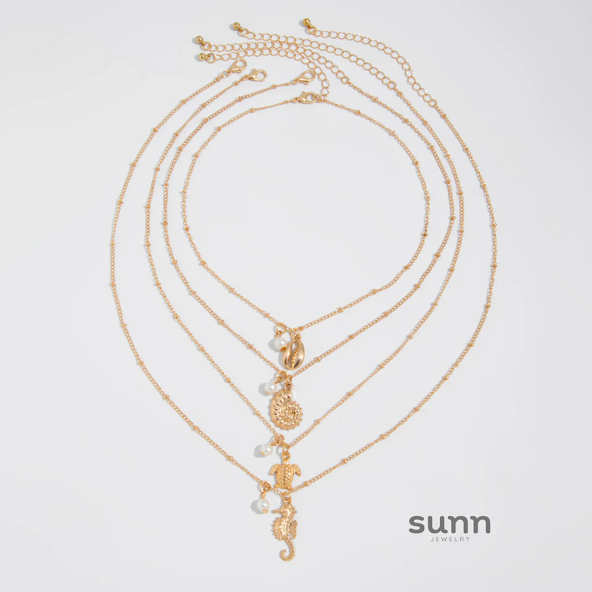 Malana Layered Pearl Charm Necklace Set