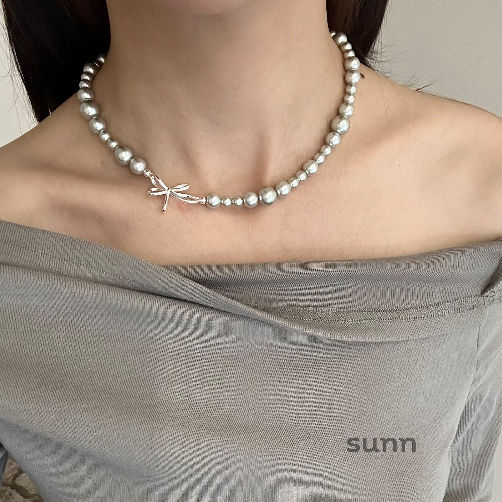 Niyah Bow Pearl Necklace [OILUYL74]