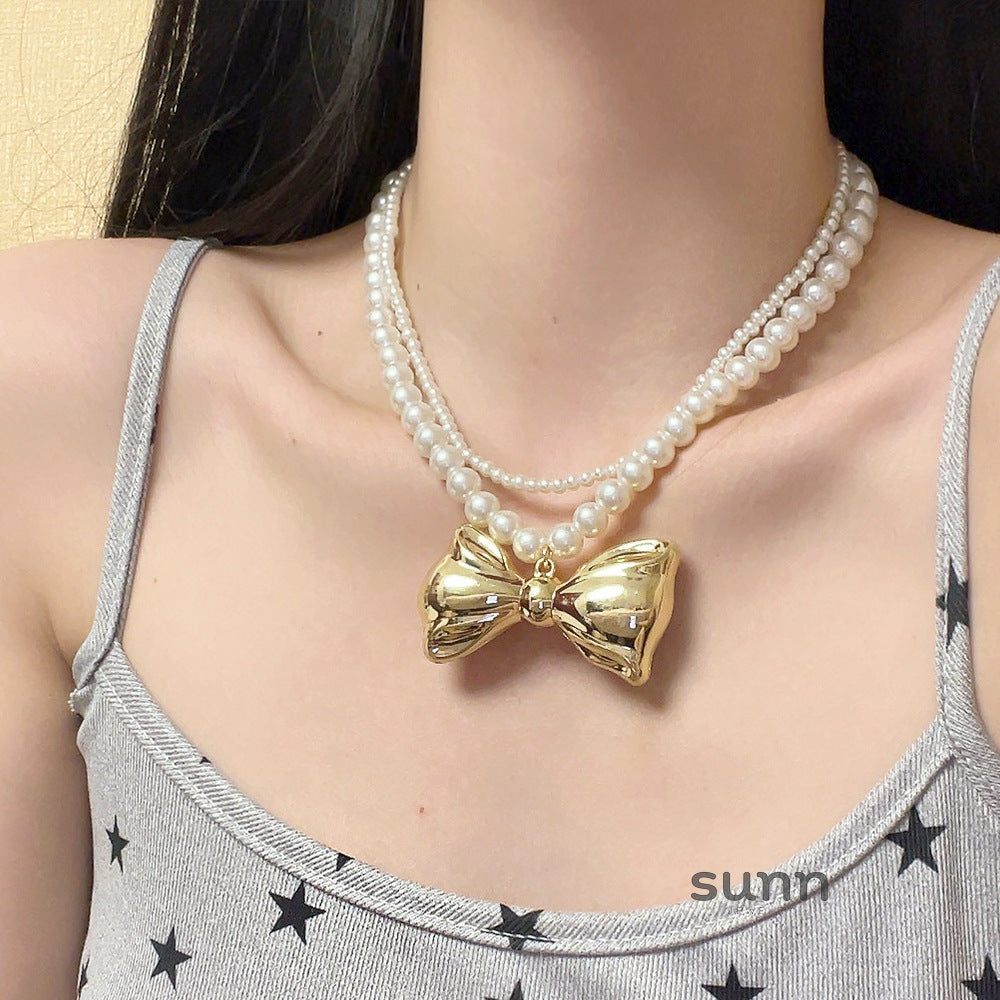 Nylah Pearl Bow Layered Necklace [HLRGITRE]