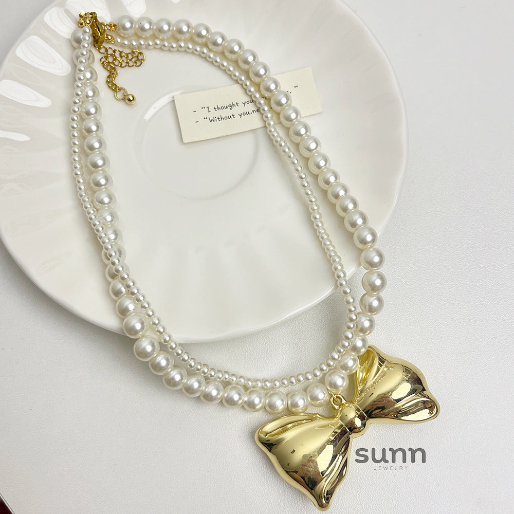 Nylah Pearl Bow Layered Necklace [M2VS8HSH]