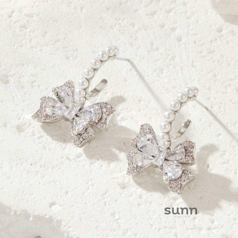 September Sparkling Bow Studs [S9MZ0RZG]