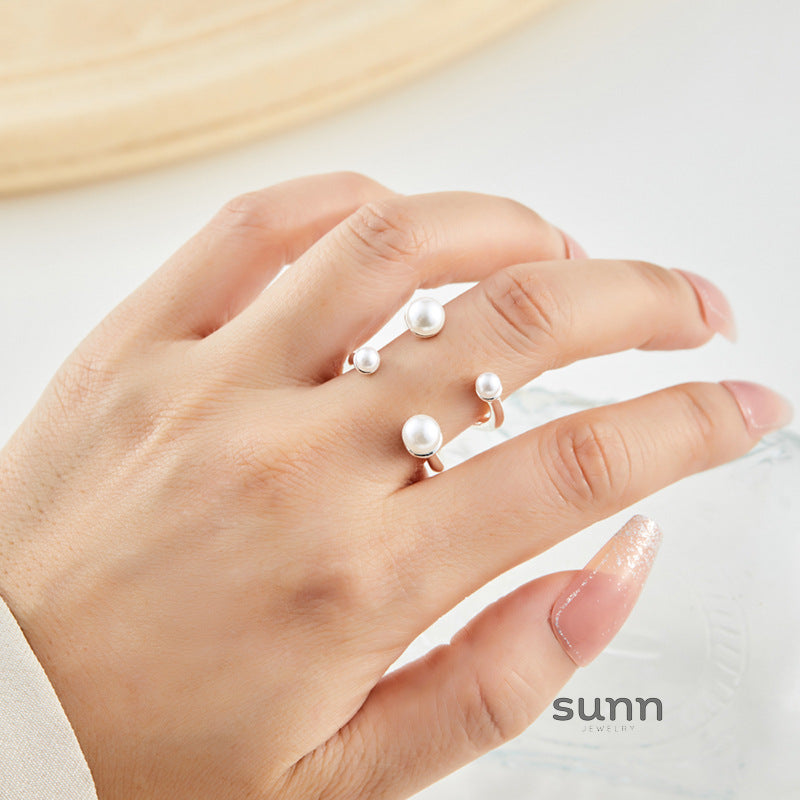 Taelor Dainty Pearl Cross Ring [NDX0OBOX]