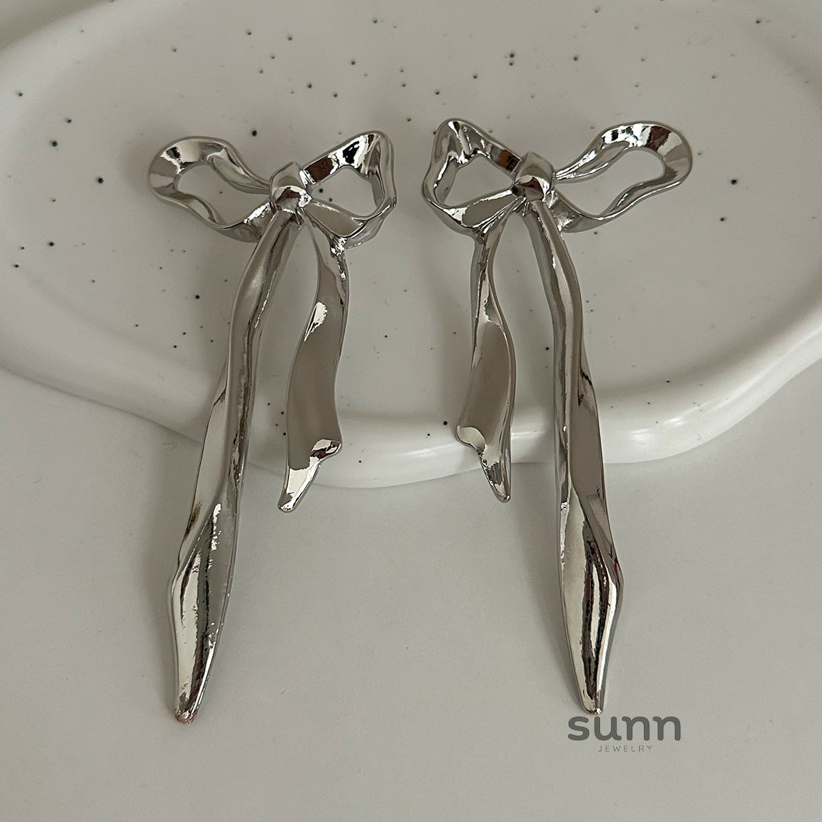 Tyra Sculptural Bow Petal Earrings [W1R2Q18S]