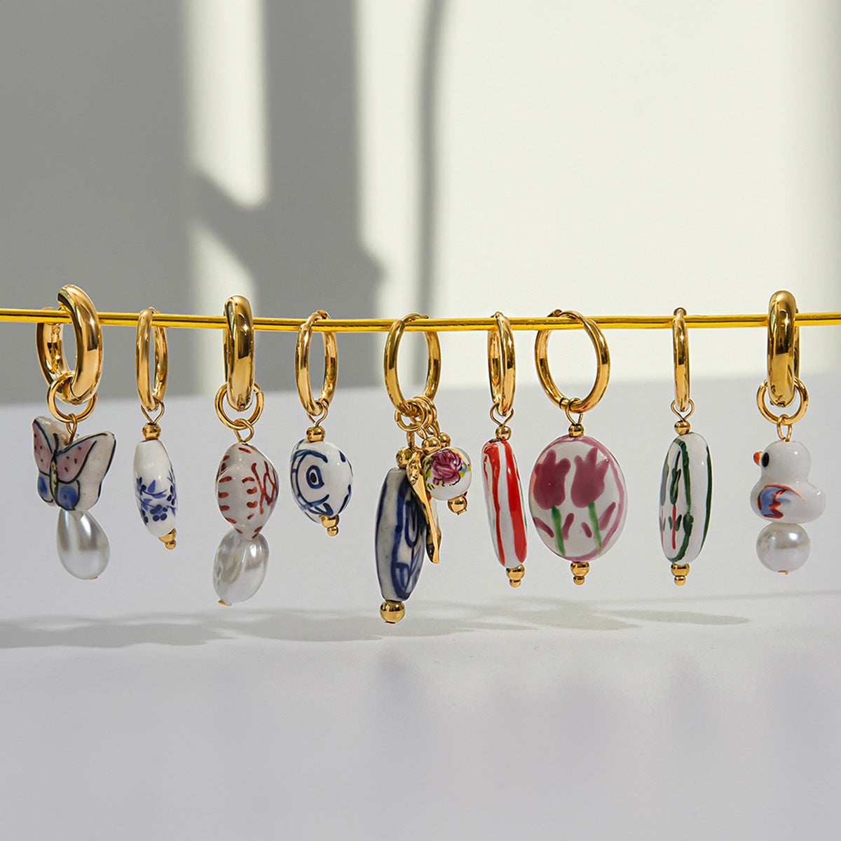 Valencia Ceramic Pearl Drop Earrings [VIHE7AXW]
